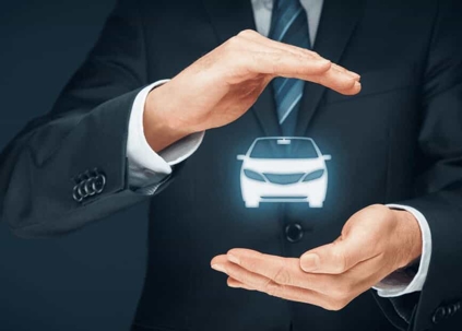 Close up of a business man's hands hovering around a glowing car graphic