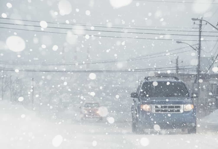 Cars driving on a street during a white out | Gaddis, Herd, Craw & Adams, P.C.