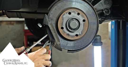 mechanic working on brakes